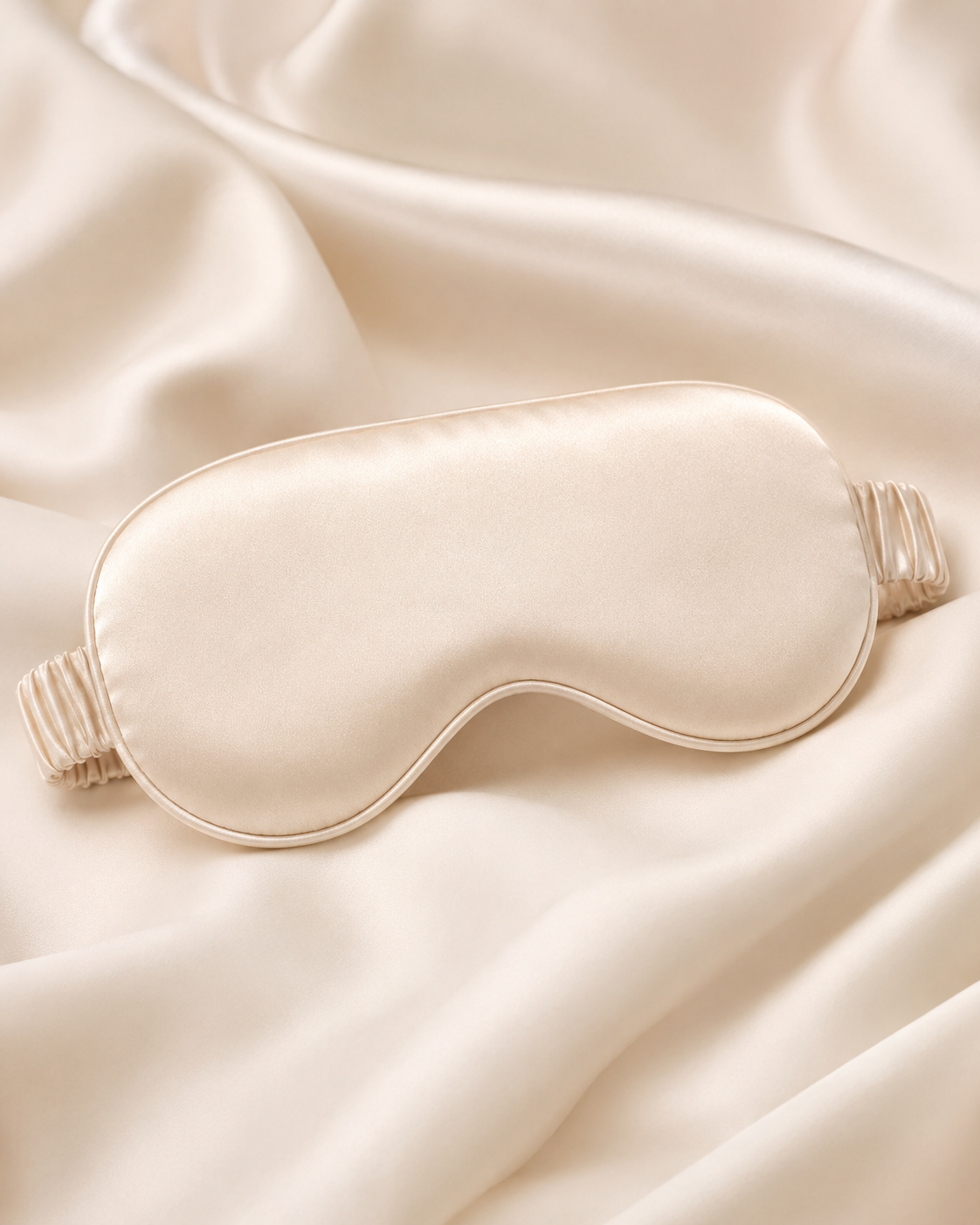 Silk sleep mask on champagne silk